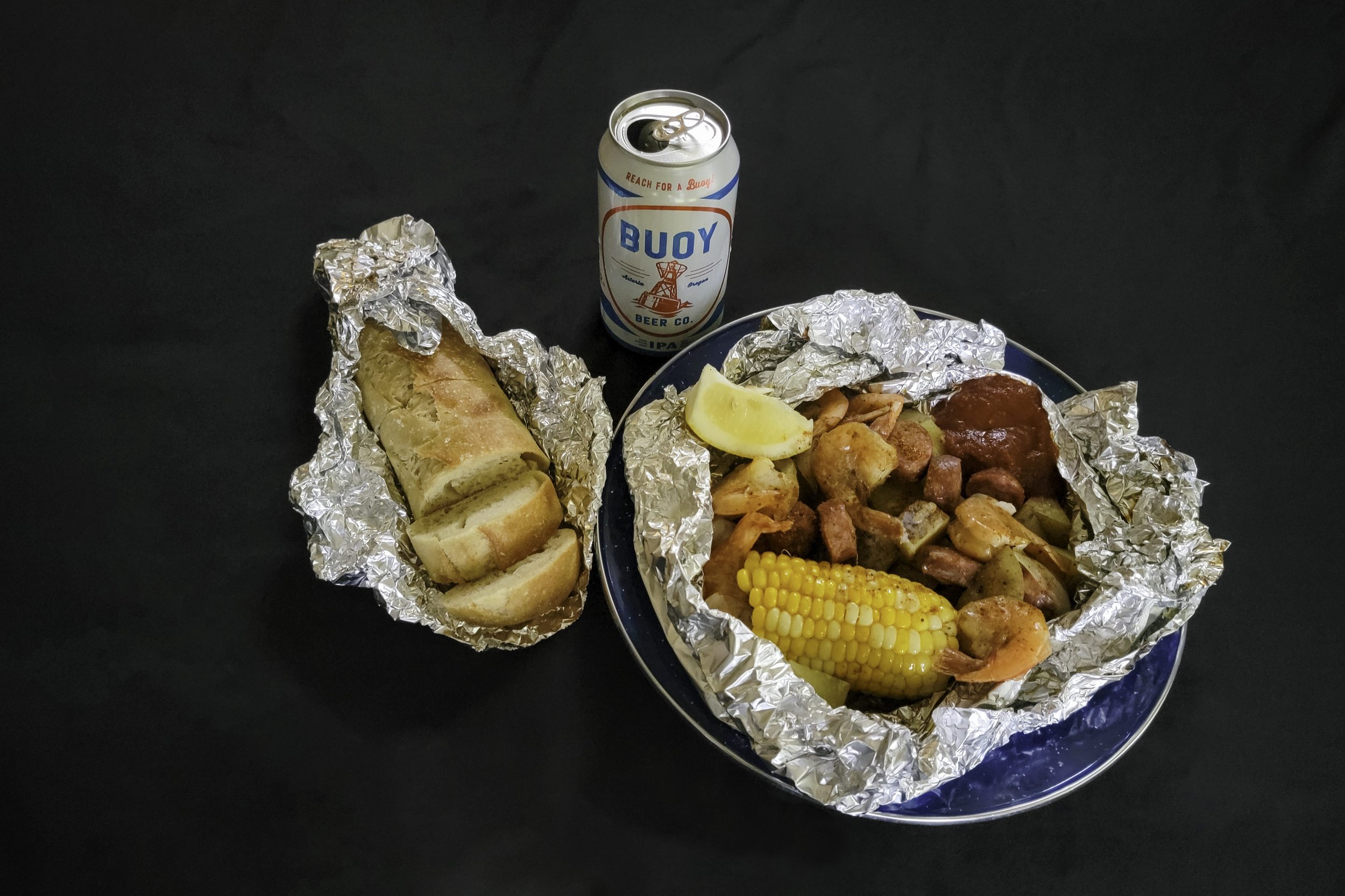 Low country boil foil packet meal with bread and beer