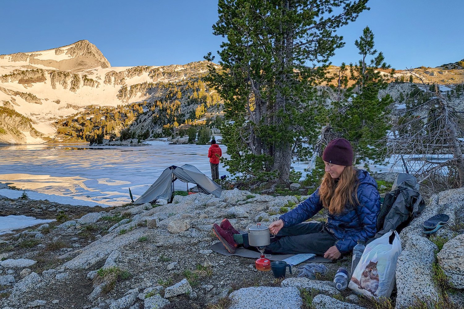 Backpackers in front of a glacial lake in the Wallowa Mountains