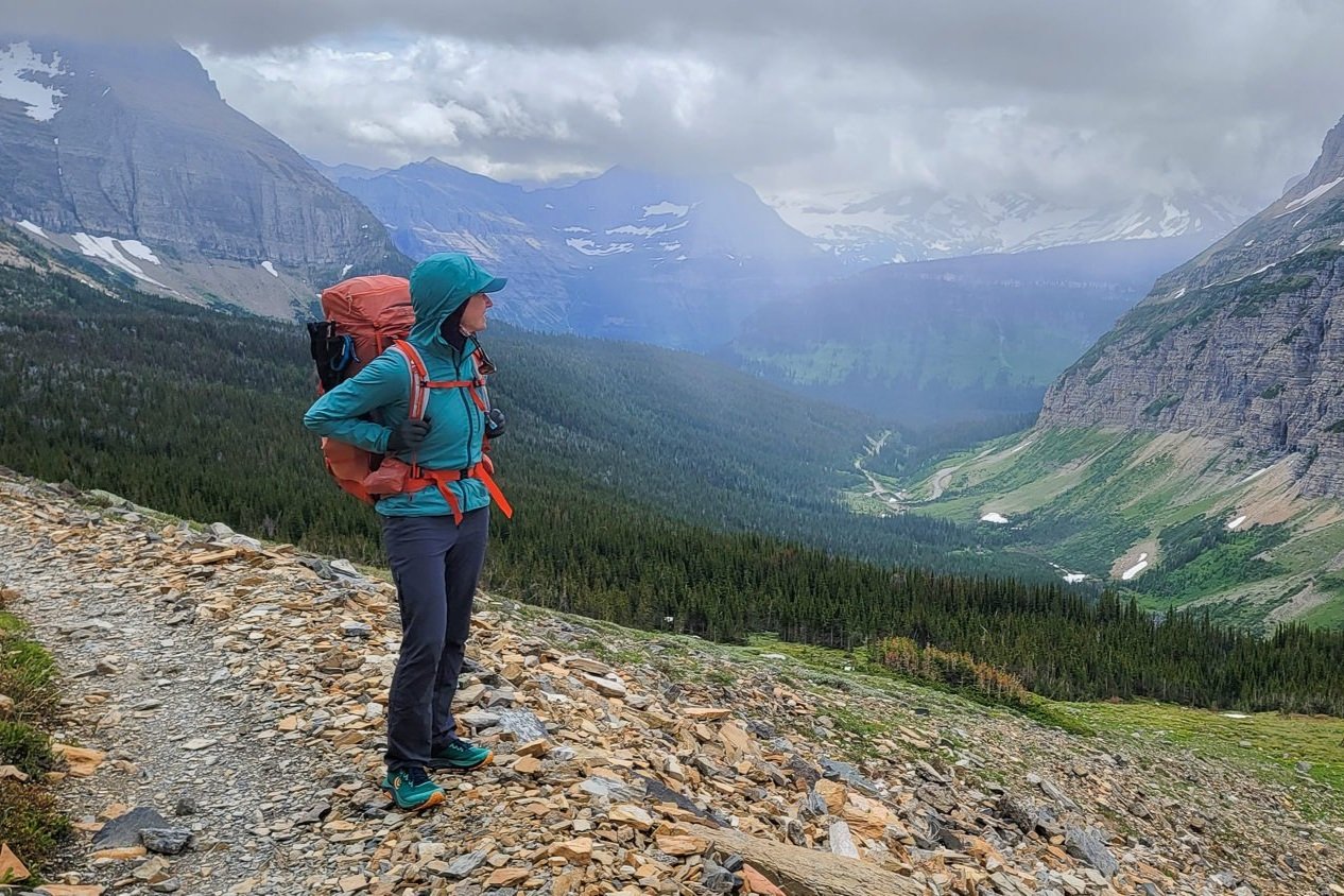A backpacker wearing the Columbia Saturday Trail Hiking Pants in Glacier National Park