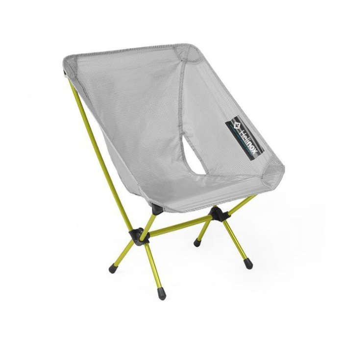 Light grey curved camping chair with bright yellow/green metal frame supports