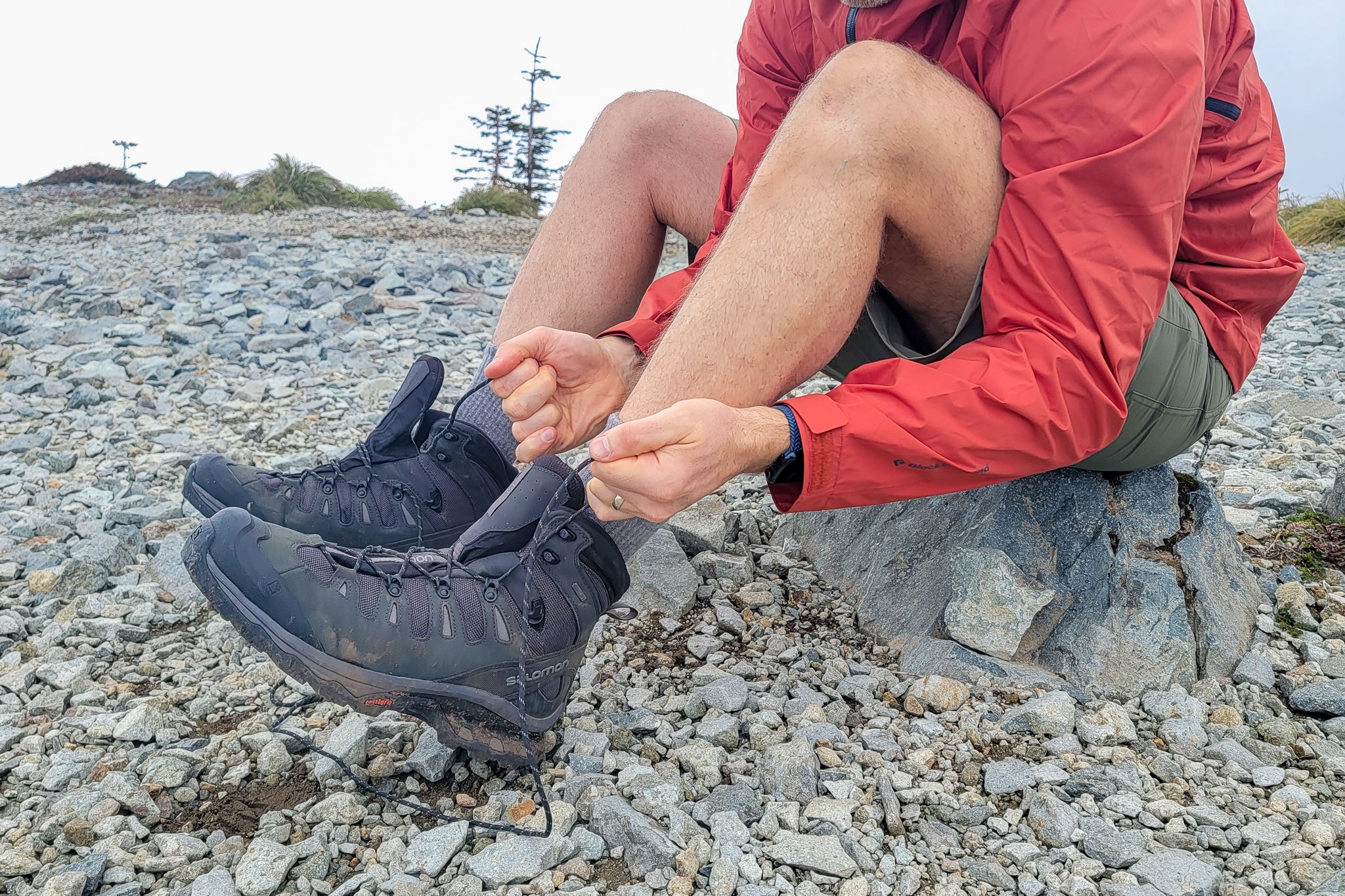 Closeup of a hiker tying the Salomon Quest 4 boots