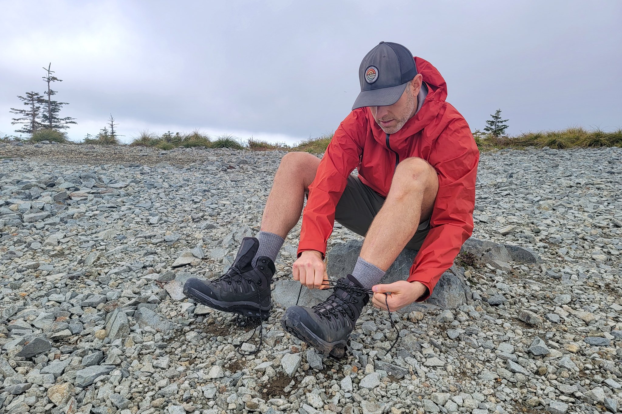 A hiker tying the Salomon Quest 4 boots