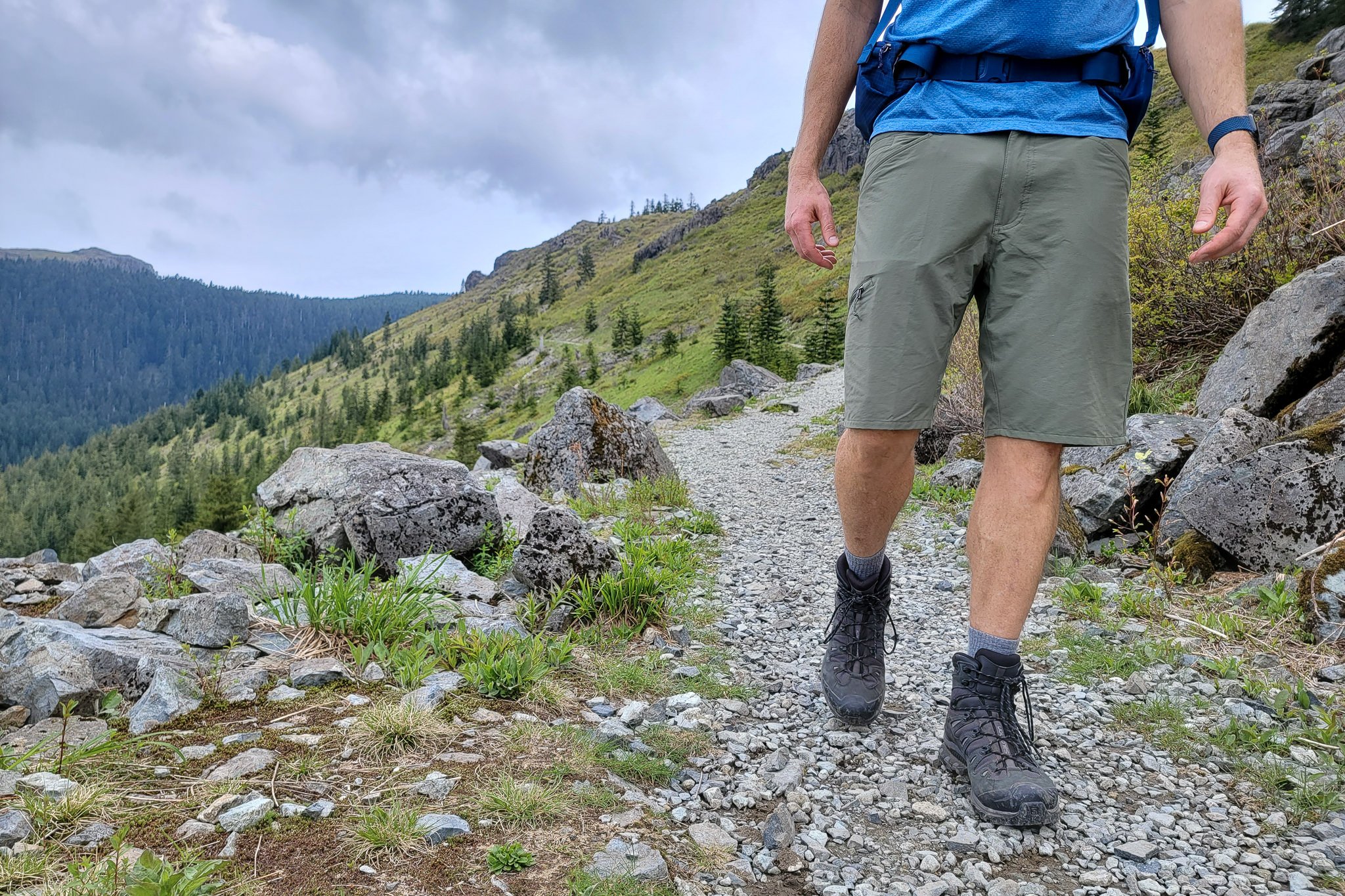 A hiker walking on a trail in Patagonia Quandary hiking shorts