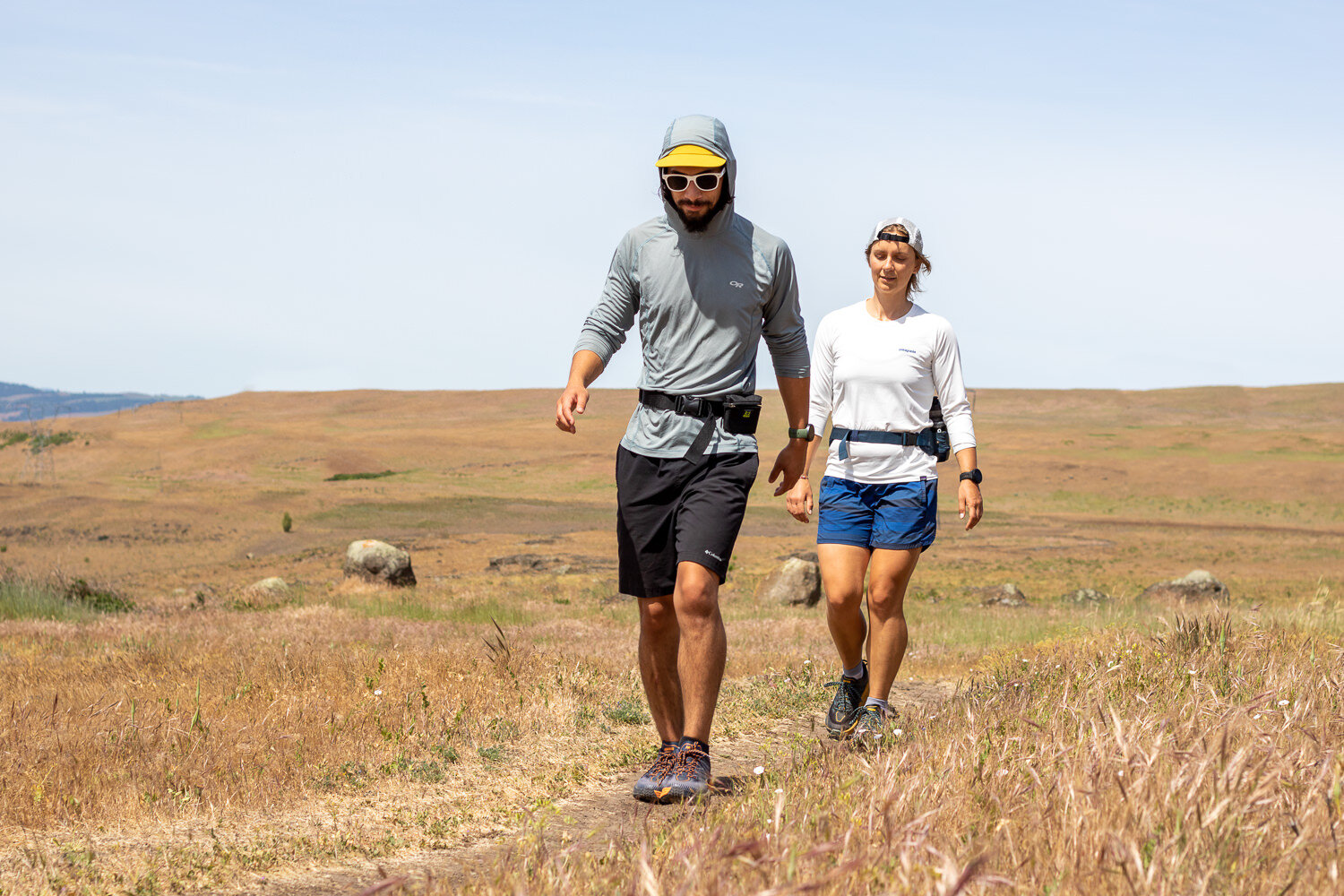 Sun shirts, like the Outdoor Research Echo Hoodie (men’s / women’s) and Patagonia Capilene Cool Daily (men’s / women’s), are perfect for wicking moisture and sun protection during a run